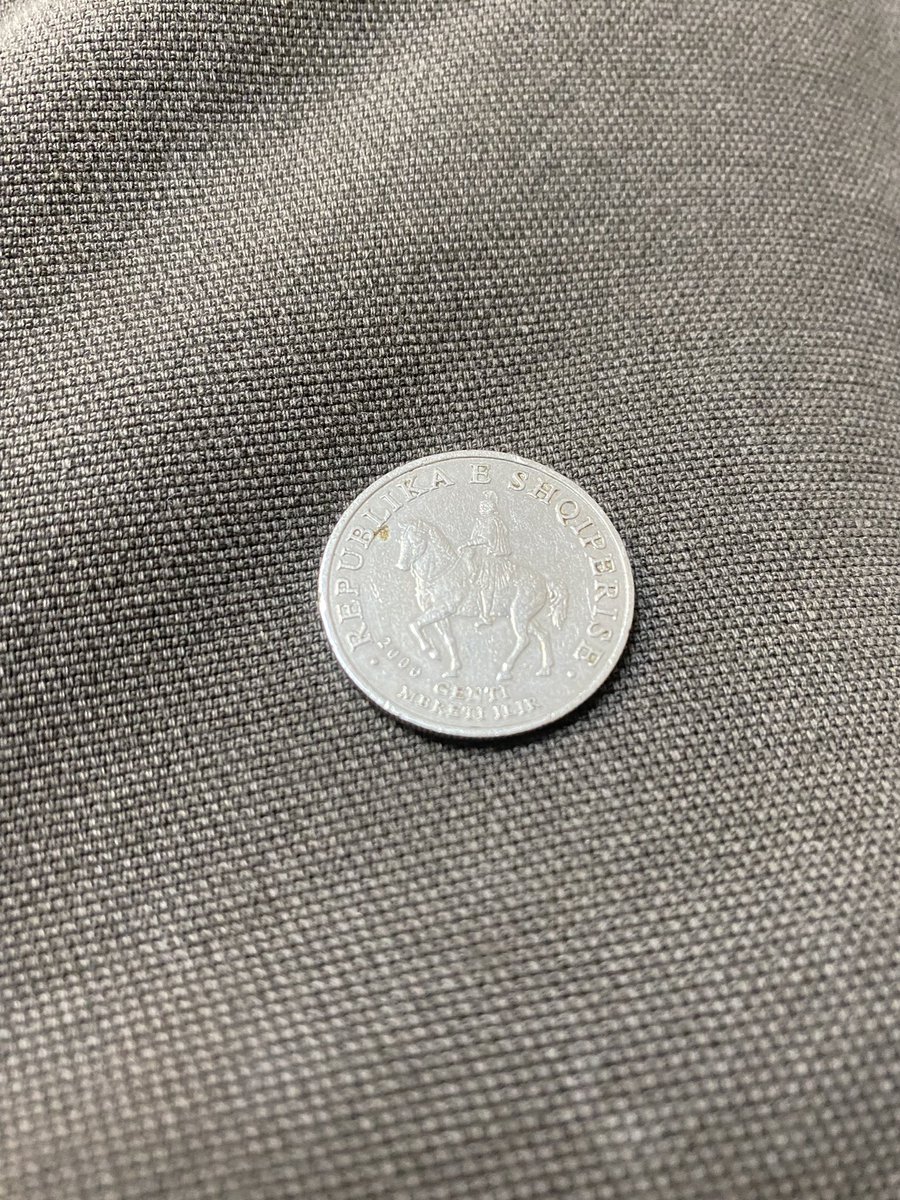 SpiritMayo's tweet photo. Bruh, how did an Albanian coin show up in my jar of coins?! https://t.co/f2WPrh5xno