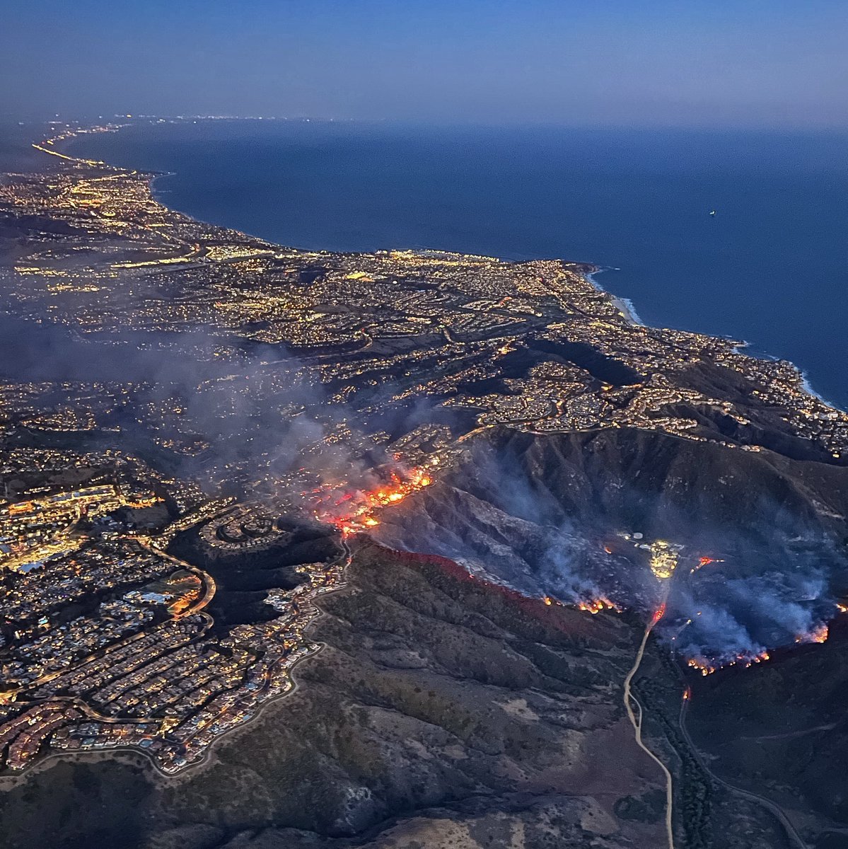 UPDATE: The community of Laguna Niguel, CA is coping with the fury of Mother Nature tonight as firefighters continue to battle the 200 acre #CoastalFire into the night. At least 20 homes destroyed, no injury reports yet.  #Air7HD <a href="/ABC7/">ABC7 Eyewitness News</a>
