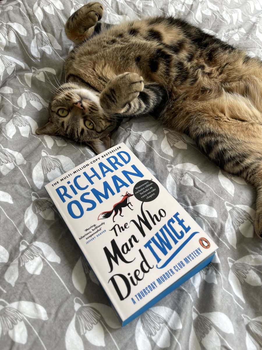 richardosman's tweet photo. I told Liesl she could have extra Dreamies if she helped me promote the new paperback of #TheManWhoDiedTwice. She delivered. https://t.co/J89I2fDZuG