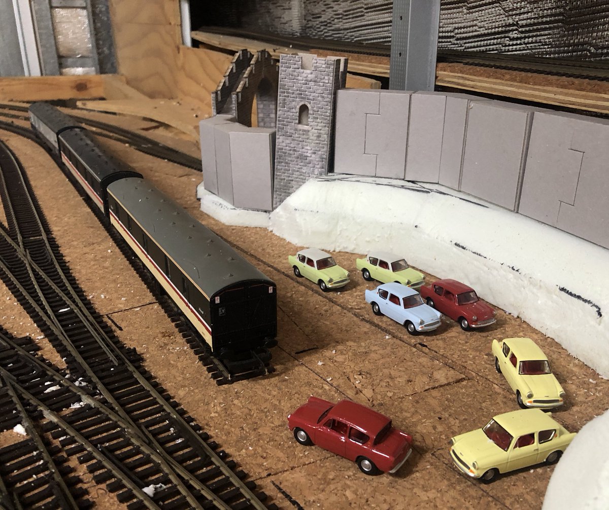 CottonTreeRail's tweet photo. The #Motorail siding has been realigned, with a curved catch-point adapted from a Peco left-hand turnout. Next steps will be to install the platform and car loading ramp, then finish the castle walls and ramparts. #TMRGUK #NewcastletonReimagined https://t.co/N5kiYGP8M3