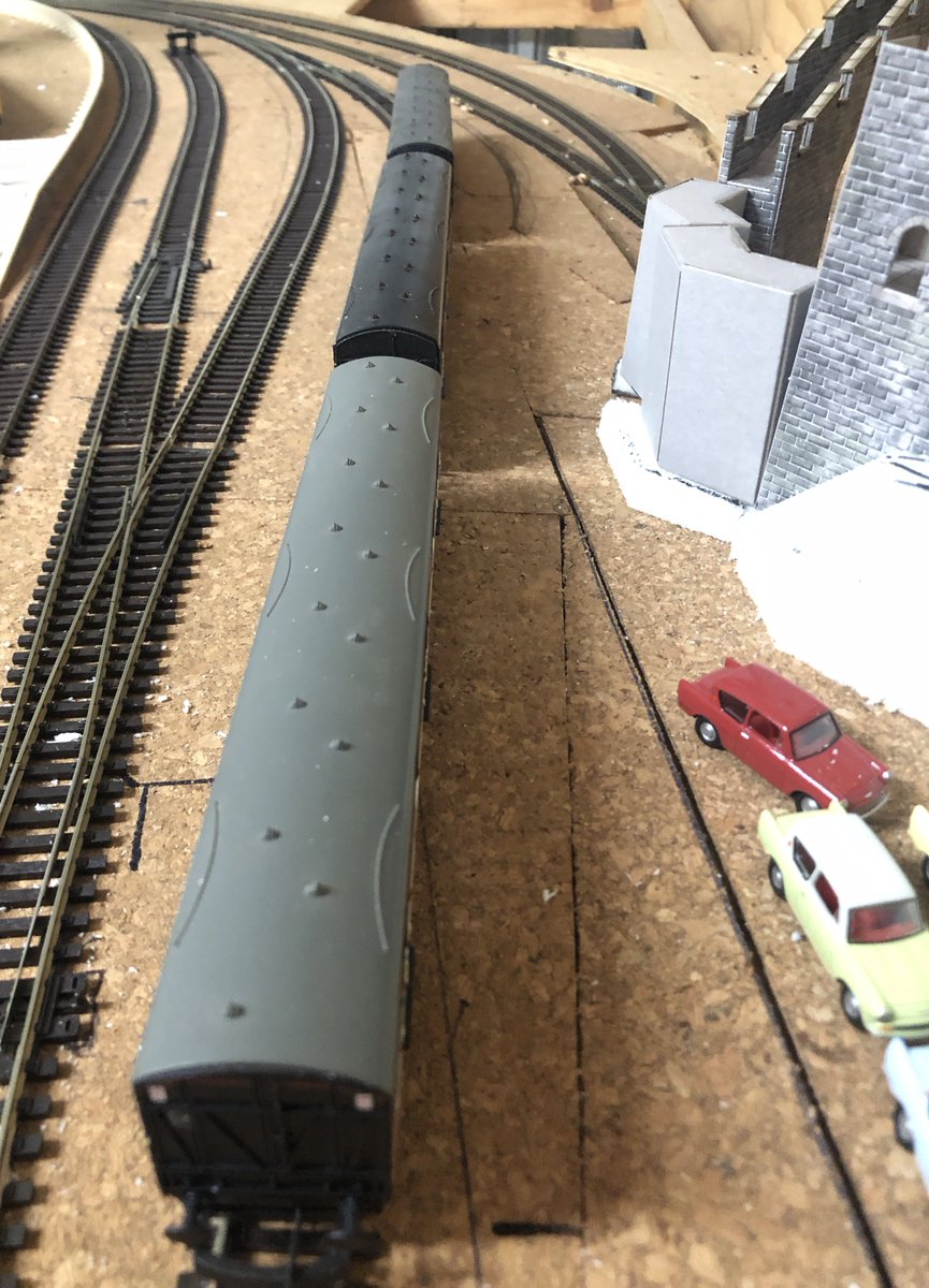 CottonTreeRail's tweet photo. The #Motorail siding has been realigned, with a curved catch-point adapted from a Peco left-hand turnout. Next steps will be to install the platform and car loading ramp, then finish the castle walls and ramparts. #TMRGUK #NewcastletonReimagined https://t.co/N5kiYGP8M3