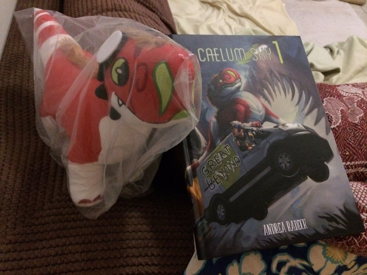 my book and Neri plush from <a href="/ALRadeck/">ALRadeck is on Bsky</a>’s kickstarter just arrived! they look AMAZING the pages are beautiful and Neri is SO CUTE she’s perfect! tempted to keep her covered so she doesn’t get coated in cat hair lmao. now she’s my bday present to mum who loves her design ❤️