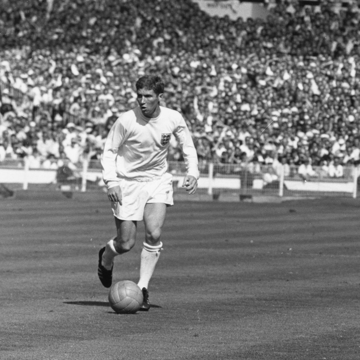 Alan Ball in action against Argentina at the 1966 FIFA World Cup.