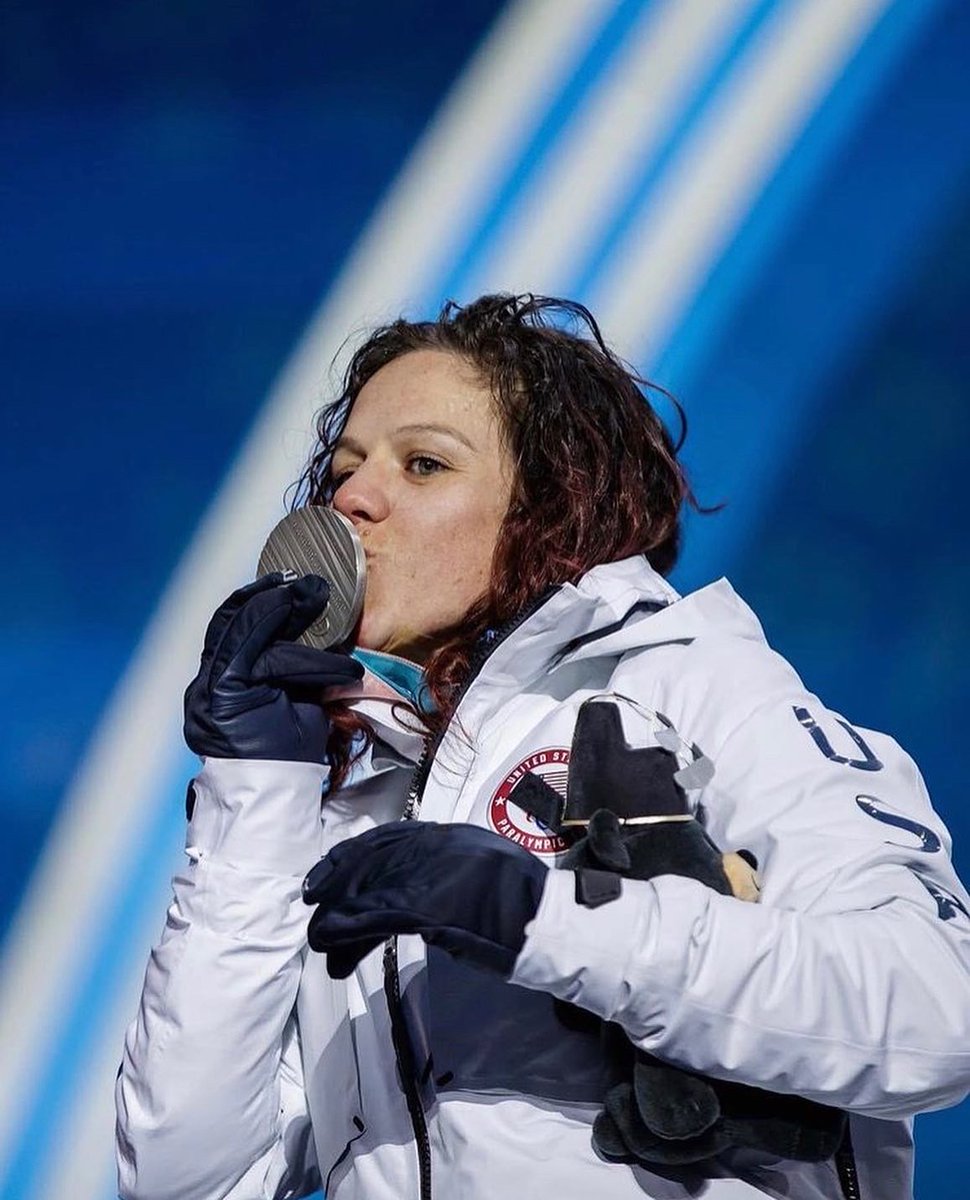 Brittani Coury on the podium at PyeongChang 2018 with her silver medal.