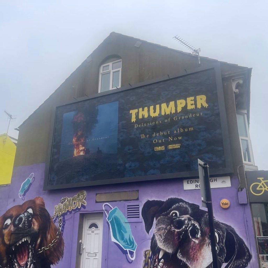 thumper666's tweet photo. En route to Brighton’s @greatescapefest - we play tomorrow (Friday) at 4.15 on the @musicvenuetrust stage 🦨

Big merch drop to whomstever takes a photo underneath our billboard on the Lewes Rd and tags us. We’ll pick a winner and give it to you at the show x 

📸 Dav https://t.co/7g9dsiWGo4