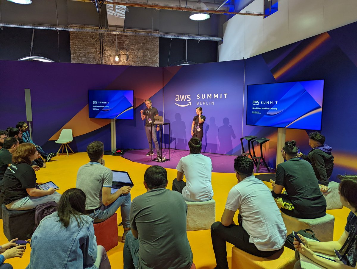 FrankPrechtel's tweet photo. The community hall at #AWSSummit  is again filled to the brim with @linda_mhmd and @AlexZehetmaier presenting "machine learning for startups". https://t.co/SM2qWyNLmc