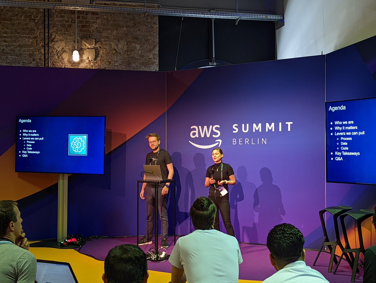 FrankPrechtel's tweet photo. The community hall at #AWSSummit  is again filled to the brim with @linda_mhmd and @AlexZehetmaier presenting "machine learning for startups". https://t.co/SM2qWyNLmc