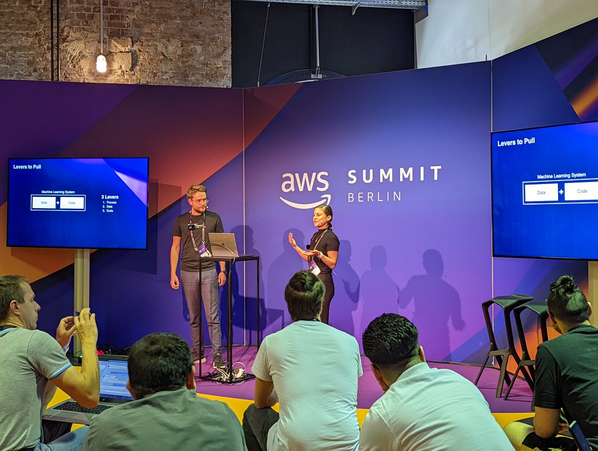 FrankPrechtel's tweet photo. The community hall at #AWSSummit  is again filled to the brim with @linda_mhmd and @AlexZehetmaier presenting "machine learning for startups". https://t.co/SM2qWyNLmc