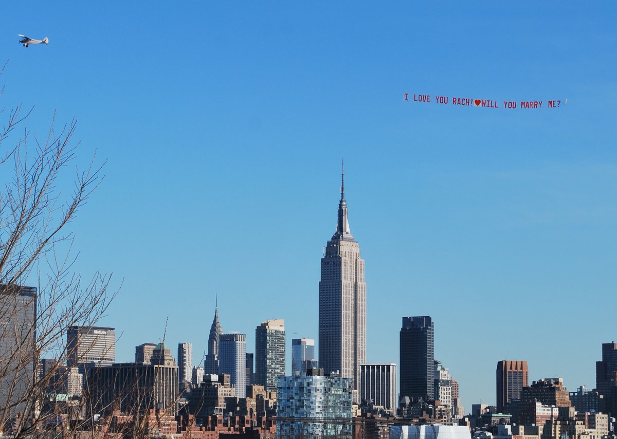 TheSkyWriters's tweet photo. Awesome backdrop of NEW YORK CITY from NEW JERSEY side, photo taken from Hoboken. Marriage proposal banner flying over the Hudson River and SHE SAID YES! Congratulations to this happy couple. #marriageproposal #flyingbanner #NewYorkCity #Hoboken #hudsonriver #happycouple https://t.co/tZILaVGzpQ