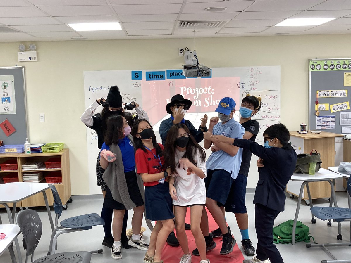 daisyteyalo's tweet photo. So happy to see that our middle schoolers were able to present freely on campus together. Their smiles (under the masks) and giggling are priceless. @ssischool #ssisworldlanguages https://t.co/cEXRbYw6bJ