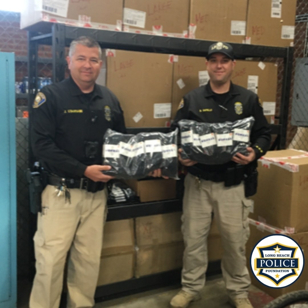 Officers Dapello &amp; Stahmann are pictured w/ annual Bombas Sock Donation for LBPD's Quality of Life Outreach teams. The LBP Foundation has provided thousands of socks to the Quality of Life teams over the years, thanks to our partnership with Bombas sock.