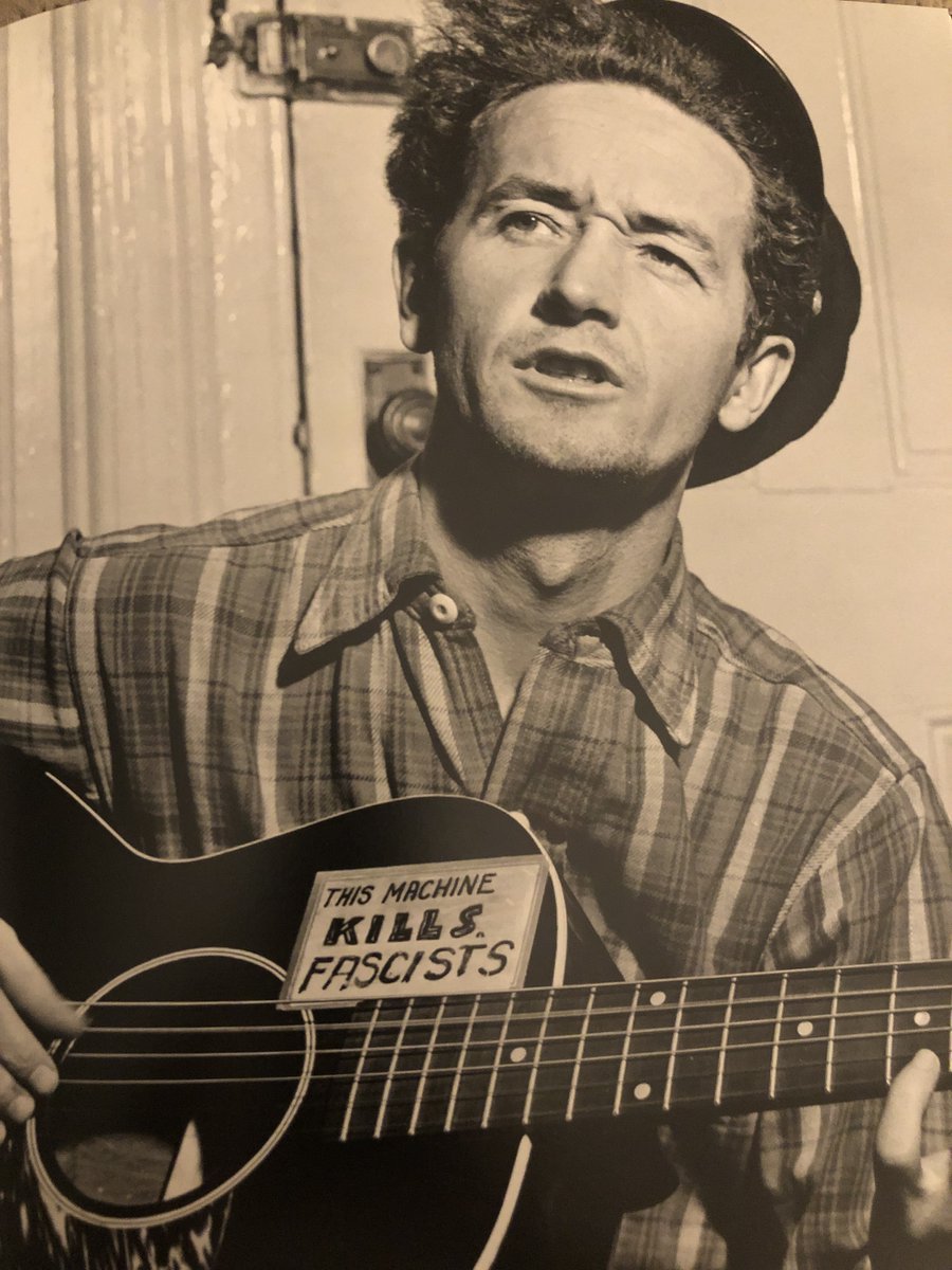 robinrimbaud's tweet photo. I always wondered as to inspiration behind these 'This synth kills fascists' stickers, and was amazed to find this photo of Woody Guthrie from the early 1940s. https://t.co/SGvMa3QyEo