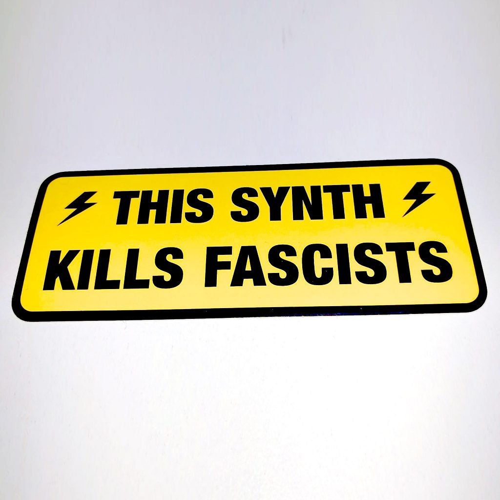 robinrimbaud's tweet photo. I always wondered as to inspiration behind these 'This synth kills fascists' stickers, and was amazed to find this photo of Woody Guthrie from the early 1940s. https://t.co/SGvMa3QyEo