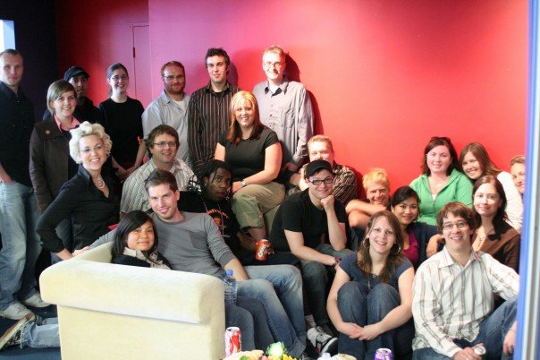EmmaTheDame's tweet photo. It's been 16 yrs since #EmmaDay: The time my department (#CHUMInteractive) threw me a big/surprise thank you party. Here we are smiling, happy & totally oblivious to the food poisoning pain that awaited us all hrs later. Thanks to @ponyup/@miVi3k for the reminder! #NeverForget https://t.co/qgQUWvksd4