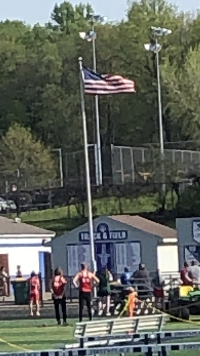 Olivia Casalinova  from the Stow girls’ track team  helps honor America with an amazing rendition of the National Anthem prior to the first Suburban League running event.