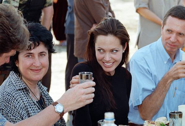 Angelina Jolie at a meeting with refugees from South Ossetia. Gizel village, North Ossetia. August 2003.
