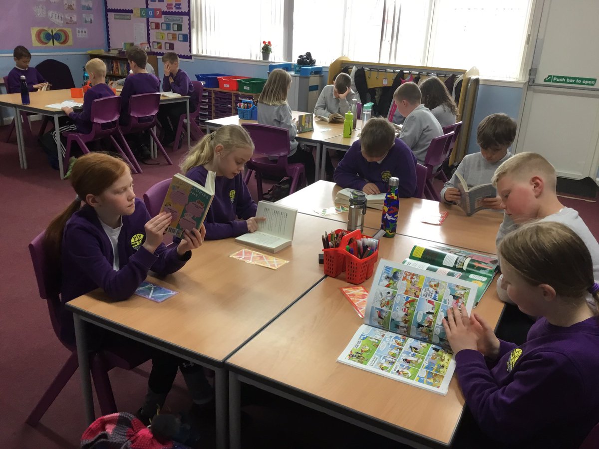 Portyschool's tweet photo. P5/6 enjoy their ERIC time- Everyone Reading In Class. It has been so good to be able to choose from all the lovely new books in our school library this year. #keeptheheidandread https://t.co/YDQhcr2GWq