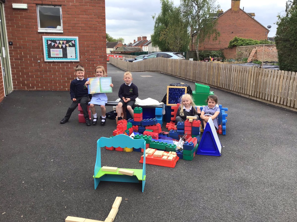 Reception children have been learning about the features of a church.  They worked together to create their own church using loose parts.