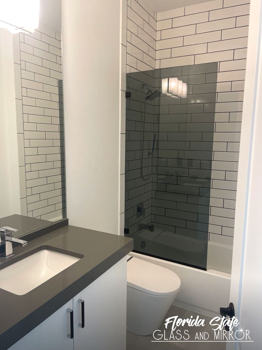 Sleek Modern Design - Create a luxurious space in your bathroom with Frameless Fixed Glass Panel Matte Black. Contact us for a quote today at 561-997-6990! #fixedpanel #fixedpanels #fixedpanelshower #glasspanel #showerpanel #glassandmirrorexperts #glassexperts #floridastateglass