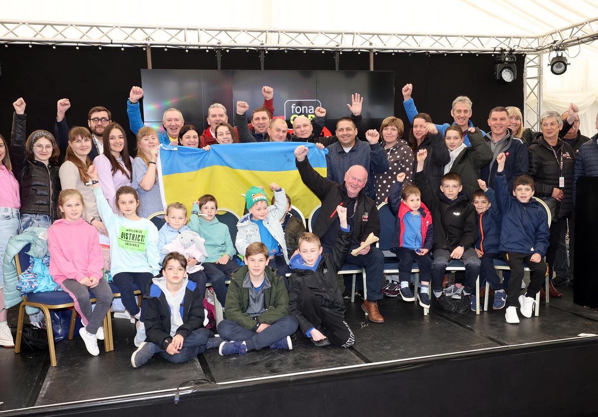 northwest200's tweet photo. A group of 32 Ukranian refugees visited the @fonacabbelfast &amp; @NichollOils NW200 today &amp; met race boss Mervyn Whyte and Councillors from @VisitCauseway before touring the paddock. The Ukranian families have been evacuated by the Faith in Action Missions charity to B’money https://t.co/cM2P9BmkKH