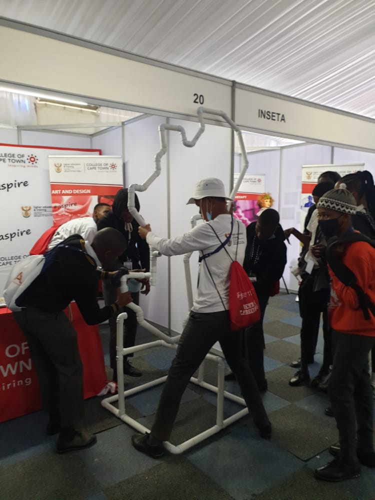 CollegeofCT's tweet photo. Competition time : Students attending the Heritage Careers Expo at  NCU TVET College  competing to assemble the  pipe that is shaped as the African Continent , Which was initially built by the College of Cape Town Plumbing Students.
@CapeTvet https://t.co/Le6B2rtYRt