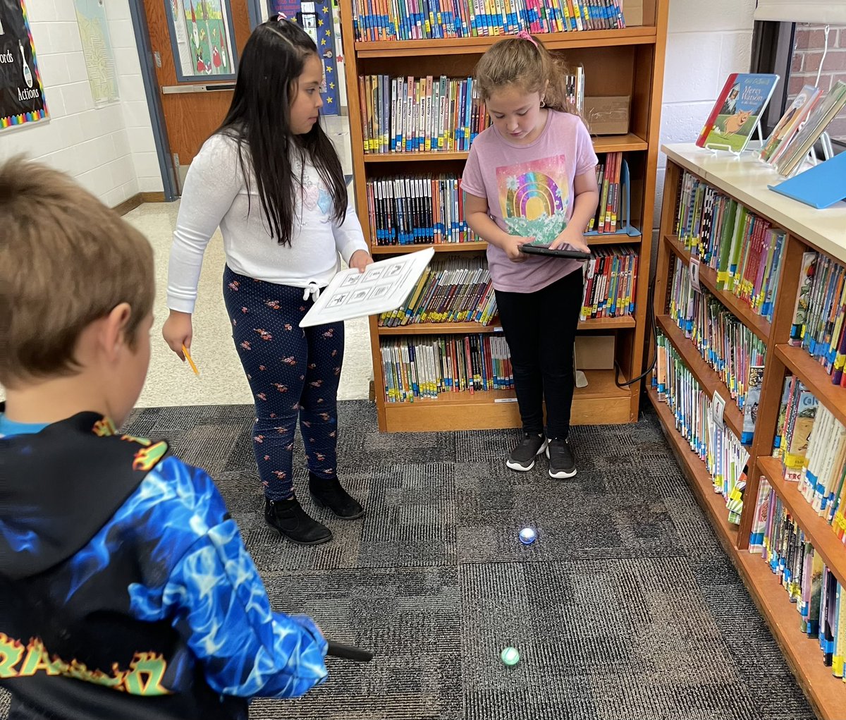 panorfle's tweet photo. 1st graders using Mini Spheros to learn to locate popular books in the library. @TechTeachVB @vbits @CentervilleVB @Taritzel11 https://t.co/WbwKg4C7J1