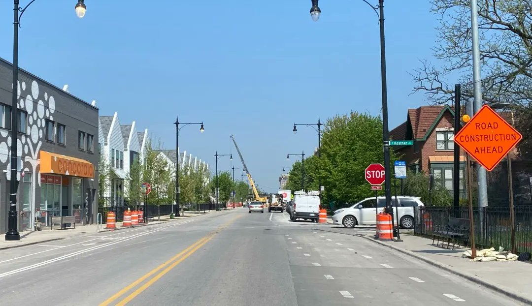 BlockClubCHI's tweet photo. Stop signs have been added to a deadly stretch of Milwaukee Avenue after two bicyclists were killed nearby. https://t.co/NaKOAUM7E9 https://t.co/kMAqIEptnz