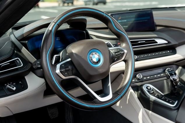 AutohausBMW's tweet photo. A RARE FIND! 2019 BMW i8 AWD ROADSTER! Finished in Crystal White Pearl Metallic w/Frozen Gray Accent over Tera Dalbergia Brown Leather with Navigation, under 17K miles, Head-up Display, Active Driving Assistant, Harmon Kardon Sound, 20" Wheels &amp; more! See https://t.co/vGbb4Xx7lS https://t.co/agjLa3sDPM