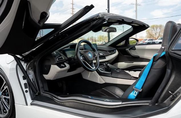 AutohausBMW's tweet photo. A RARE FIND! 2019 BMW i8 AWD ROADSTER! Finished in Crystal White Pearl Metallic w/Frozen Gray Accent over Tera Dalbergia Brown Leather with Navigation, under 17K miles, Head-up Display, Active Driving Assistant, Harmon Kardon Sound, 20" Wheels &amp; more! See https://t.co/vGbb4Xx7lS https://t.co/agjLa3sDPM