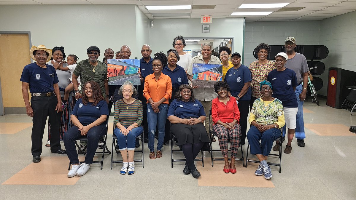 CityofTampa's tweet photo. At this "Meet the Artist" event, artist Nneka Jones spoke to members of the Woodland Terrace Neighborhood Watch about her proposed sports-themed mural for the Gwen Miller Community Center. The colorful piece is commissioned by the City of Tampa, Arts &amp; Cultural Affairs Division. https://t.co/rdAYP9yQLf