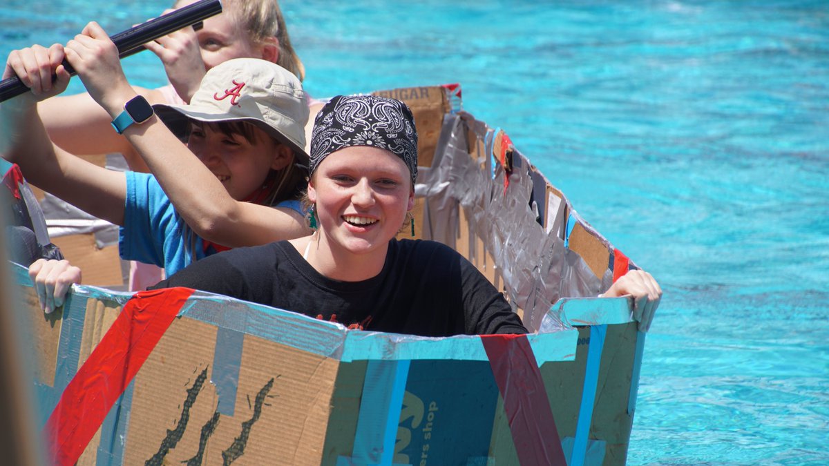 UMSWright's tweet photo. To complete their unit on Fluid Mechanics, Mrs. Cullen's Honors Physics classes had to design and construct a boat that would float 2 students from one side of Lubel Pool to the other. The catch...they could only use cardboard boxes and duct tape! #clearpathforpotential https://t.co/l01Aw9SrsM