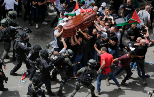 S. African police in '87 attacking the coffin of Ashley Kriel to seize the ANC flag that draped it; Israeli police attacked the coffin of #ShireenAbuAkleh today, trying to seize Palestinian flags. Apartheid regimes waging war on their victims, even after death