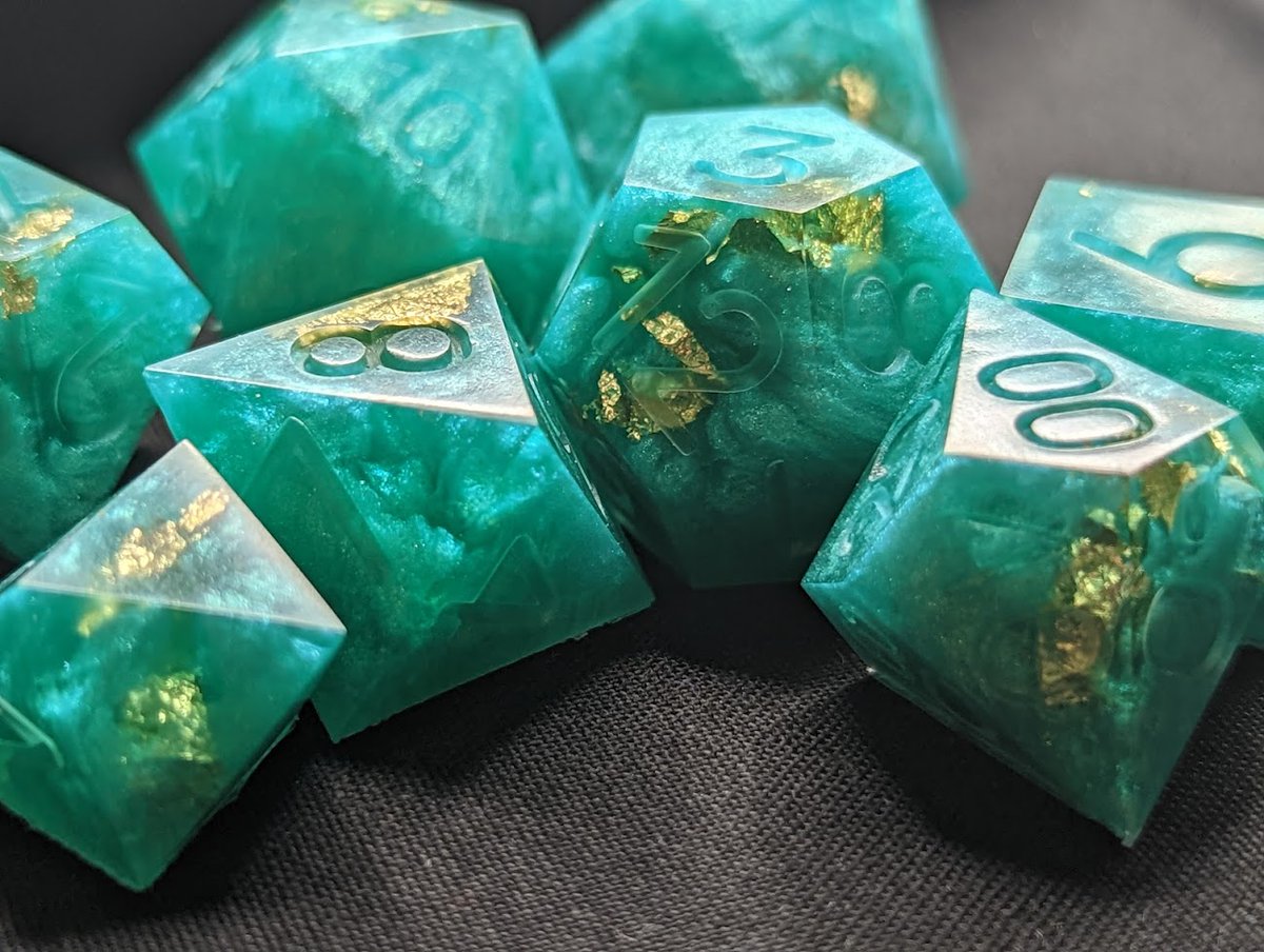 FishMakesDice's tweet photo. These started out trying to be sea glass and found their way to jade. Intended? No. Awesome? Yes. 

#handmadedice #dice #dicemaker #ttrpg #dnd #dungeonsanddragons #diceset #dnddice #resin #resinart #dicegoblin #mathrocks https://t.co/ueQUBqM29O