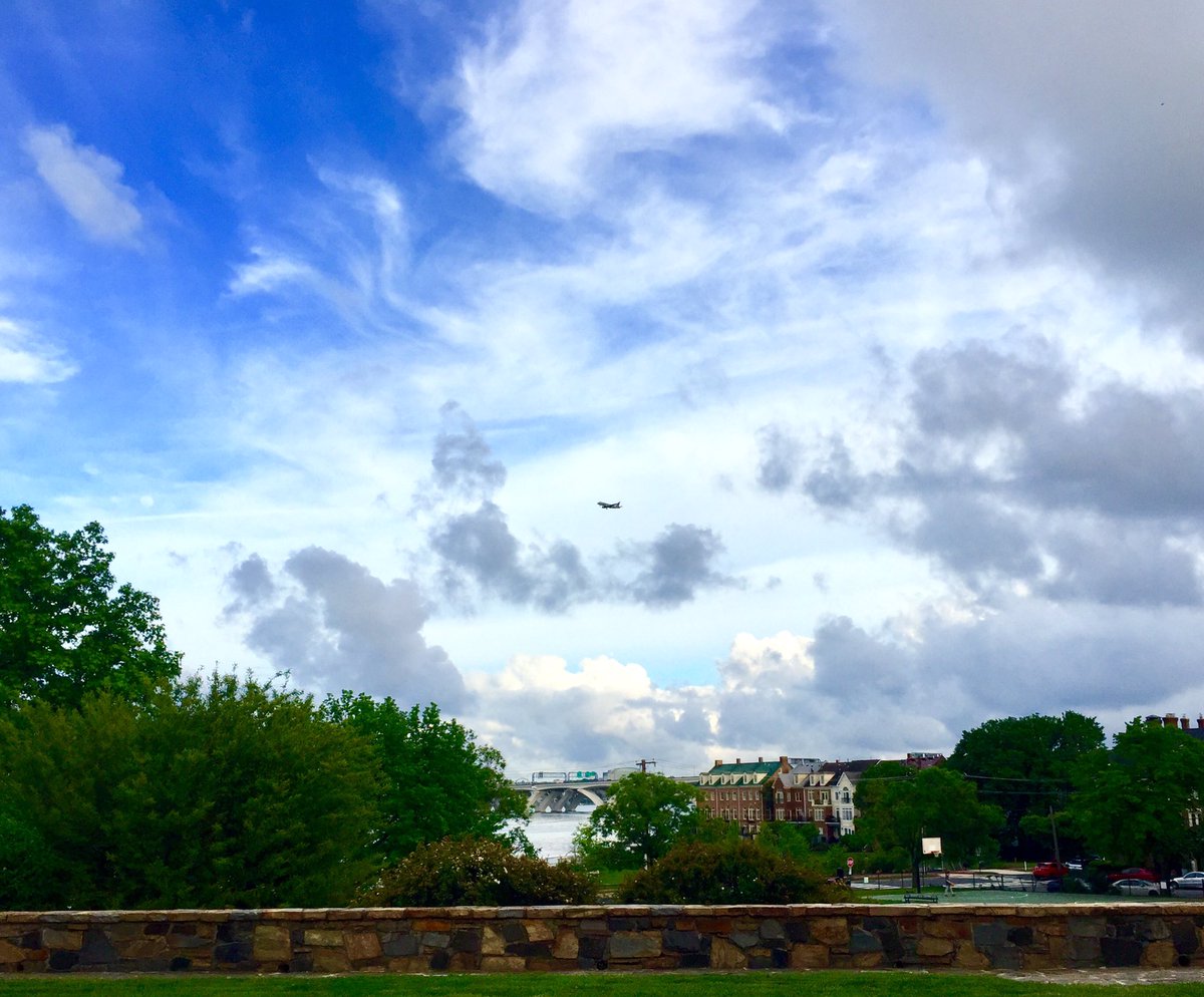 HobanGirl's tweet photo. After a long week of clearing, hauling, digging & planting, I was an eager ambling Annie taking the long way home, biding time, enjoying the blue patches before storm clouds gather to regroup. #WilkesStreet #TheHeights view of #WilsonBridge & a volleyball game on #UnionStreet https://t.co/aYEbrxANfH