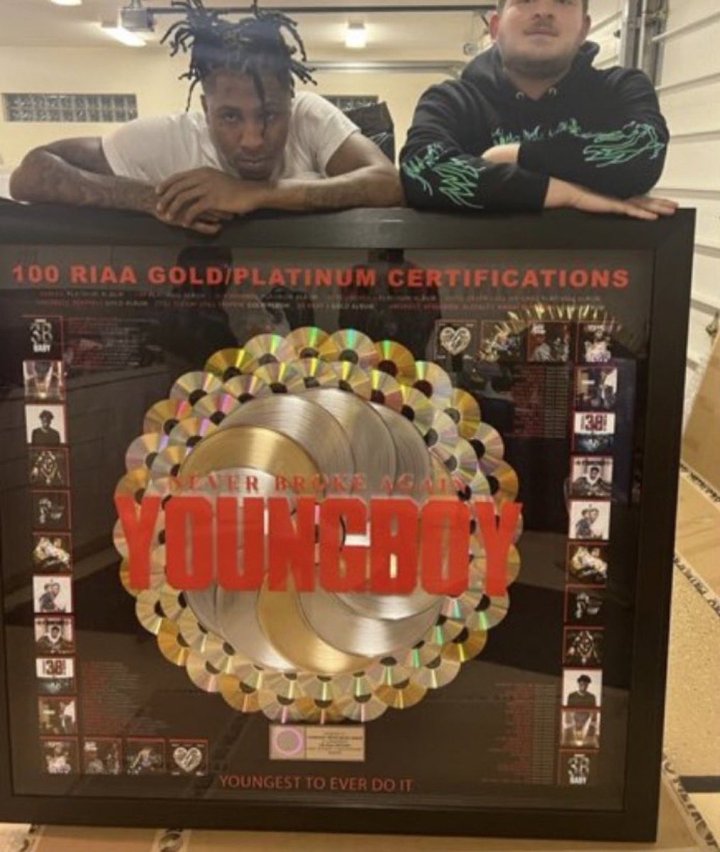 SaycheeseDGTL's tweet photo. NBA YoungBoy shows off plaques for having 100 Gold and Platinum singles 🐐💿 https://t.co/kvP7hQ8lwy