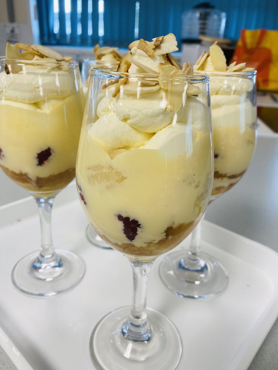 NovaCooks's tweet photo. #Trifle Live Modelling with Y10. High level skills. Base is hand made #SwissRoll, fresh, decadent double cream #custard #StrawberryJelly #bananas #raspberries #OrangeJuice #ToastedAlmonds - we are bang on trend with #PlatinumPudding https://t.co/Y7fG4zJMio