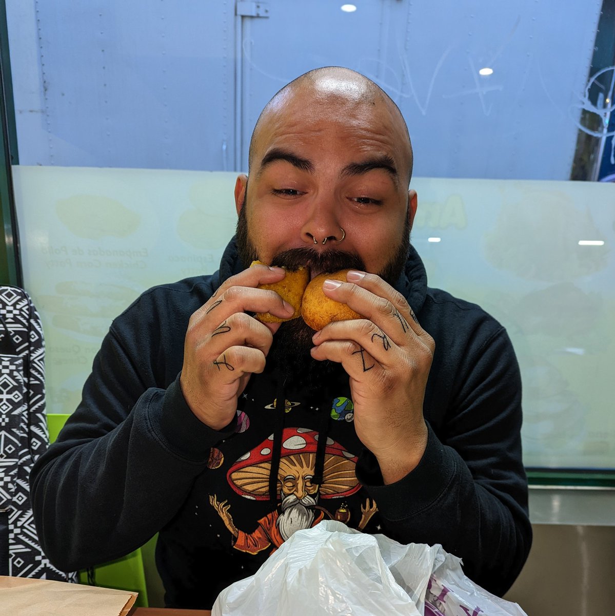 Goosepoop249's tweet photo. My last morning in New York before my flight, I was with @RenesRivera trying to eat an empanada and pandebono at the same time.. #colombianfood #imjusthigh #imdifferent https://t.co/TvxdrCU68o