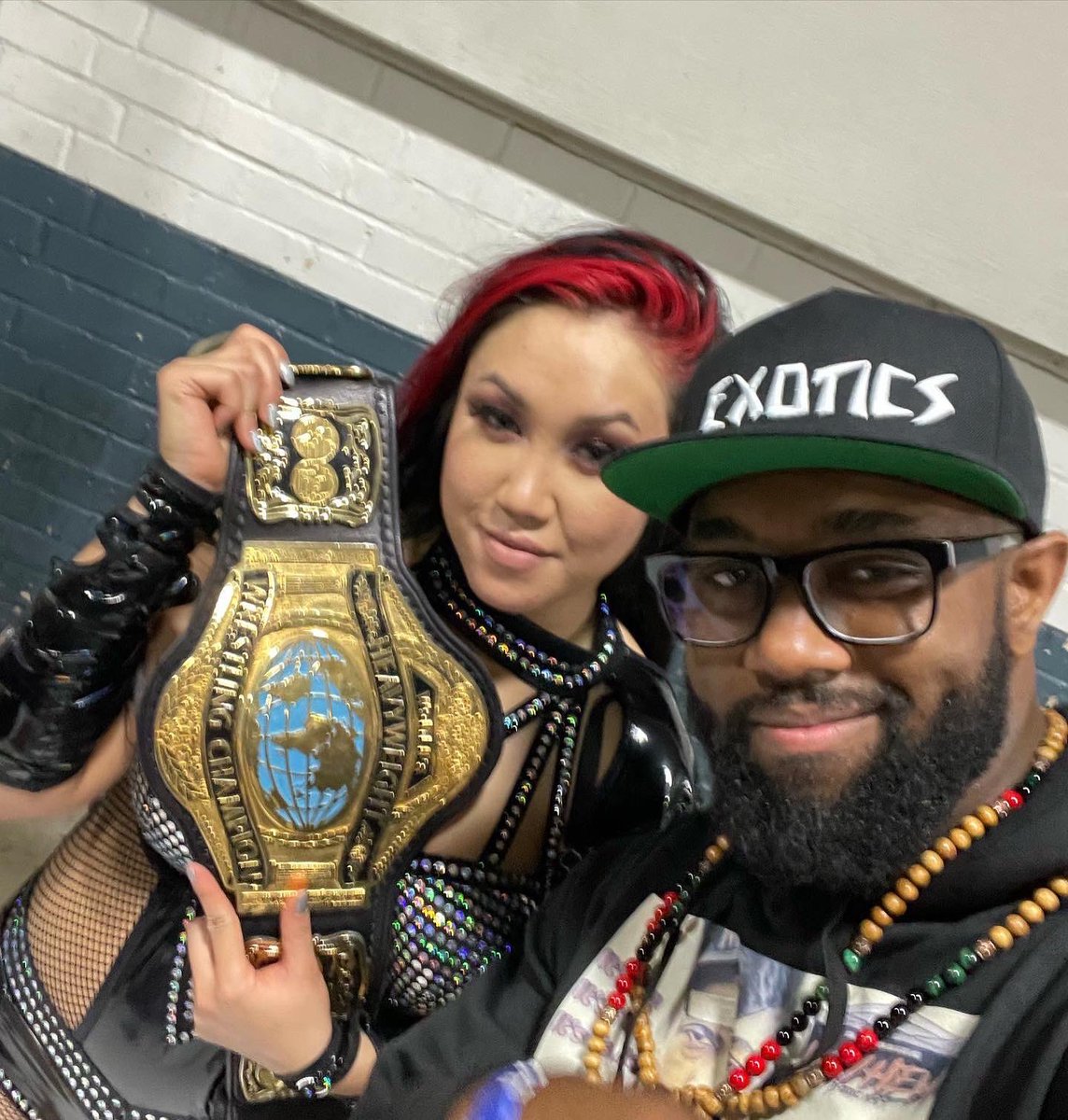 SmarkPsychPod's tweet photo. Our GM @GMKlassickRSM celebrates with THE NEWWWWW  and first ever 2X @PCWULTRA ULTRA WOMAN CHAMP @HellBentVixen AKA (once again) Viva 4 Belts!!! https://t.co/unc8aKUEMe