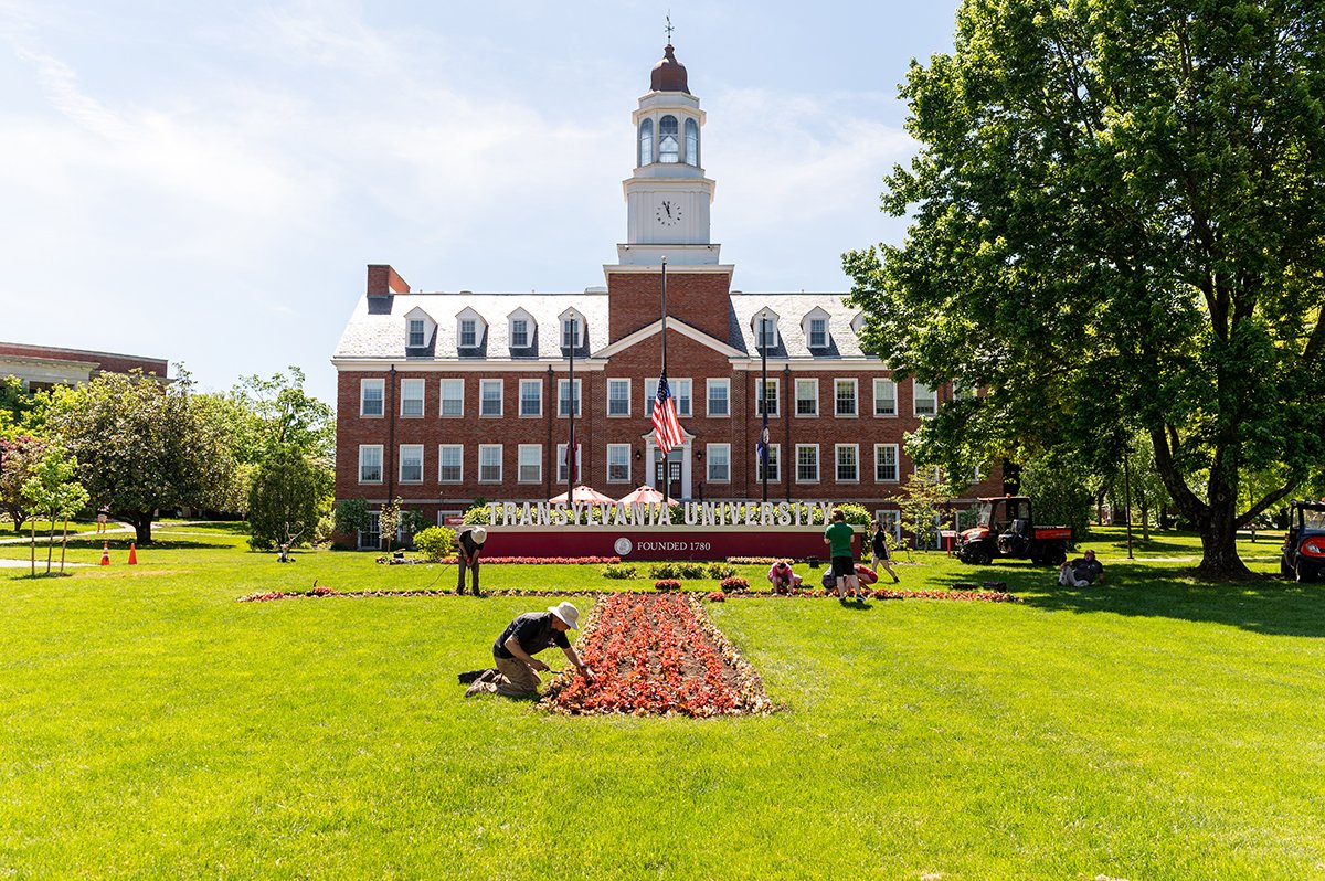 Transy's tweet photo. The Transylvania grounds crew — with he help of our Student Government Association and other volunteers —  planted the flower T in Carpenter Circle yesterday. This year's planting included 1,080 red begonias and 504 white ones. #TransyTradition https://t.co/8rK9lndy77