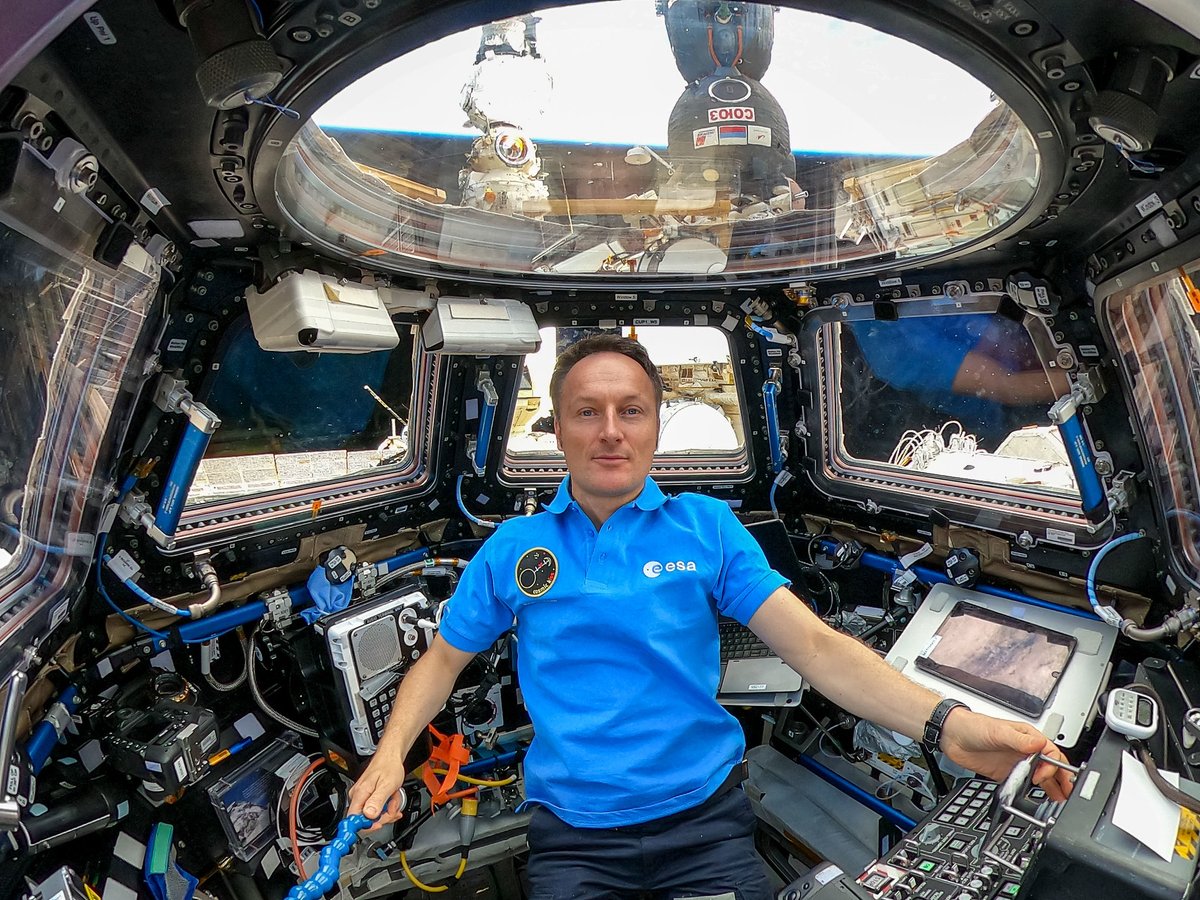 iss066e085145 (Nov. 30, 2021) --- ESA (European Space Agency) astronaut and Expedition 66 Flight Engineer Matthias Maurer is pictured inside the seven-windowed cupola, the International Space Station's "window to the world." Just outside the cupola and behind Maurer is a portion of the Soyuz MS-19 crew ship docked to the Rassvet module and the Prichal docking module attached to the Nauka multipurpose laboratory service module.