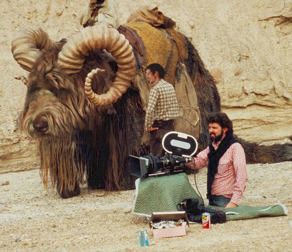 SharmanRicky's tweet photo. Time Travellers aka Everybody Loves Bantha 

aka Happy Birthday to the father of the best space opera to date: #GeorgeLucas

Our bantha doesn’t look too happy (poor Ricky, most likely, didn’t expect to become an extra in a film about space wizards) 👀 

#danielsharman  #StarWars https://t.co/q0rdpAumlc