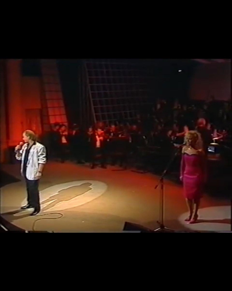 angelineball's tweet photo. Since it’s ‘cool’ now to be associated with the #EurovisionSongContest 
Here’s the late great #LiamRiley of #bagatelle battling our song out for a place in 1988.When dreams were big and hair was even bigger!🥴💖 https://t.co/8122MN2uAy
