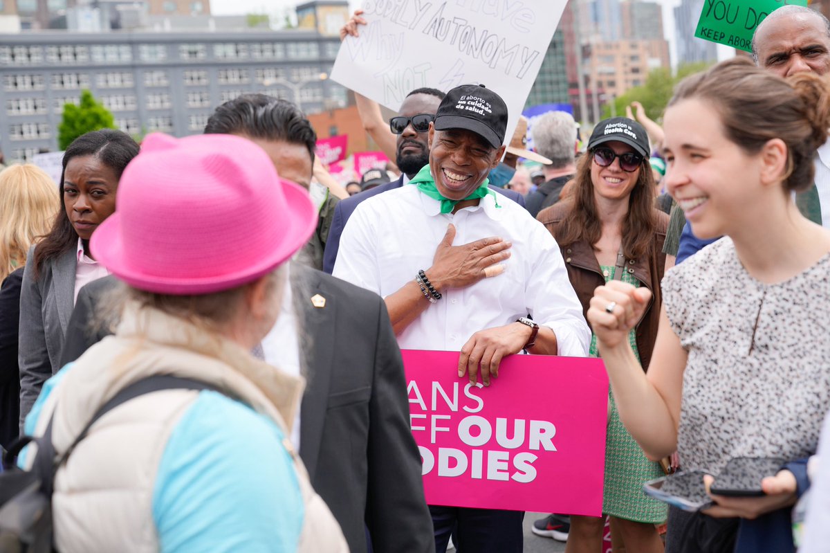 Mayor Adams greets protesters on the bridge