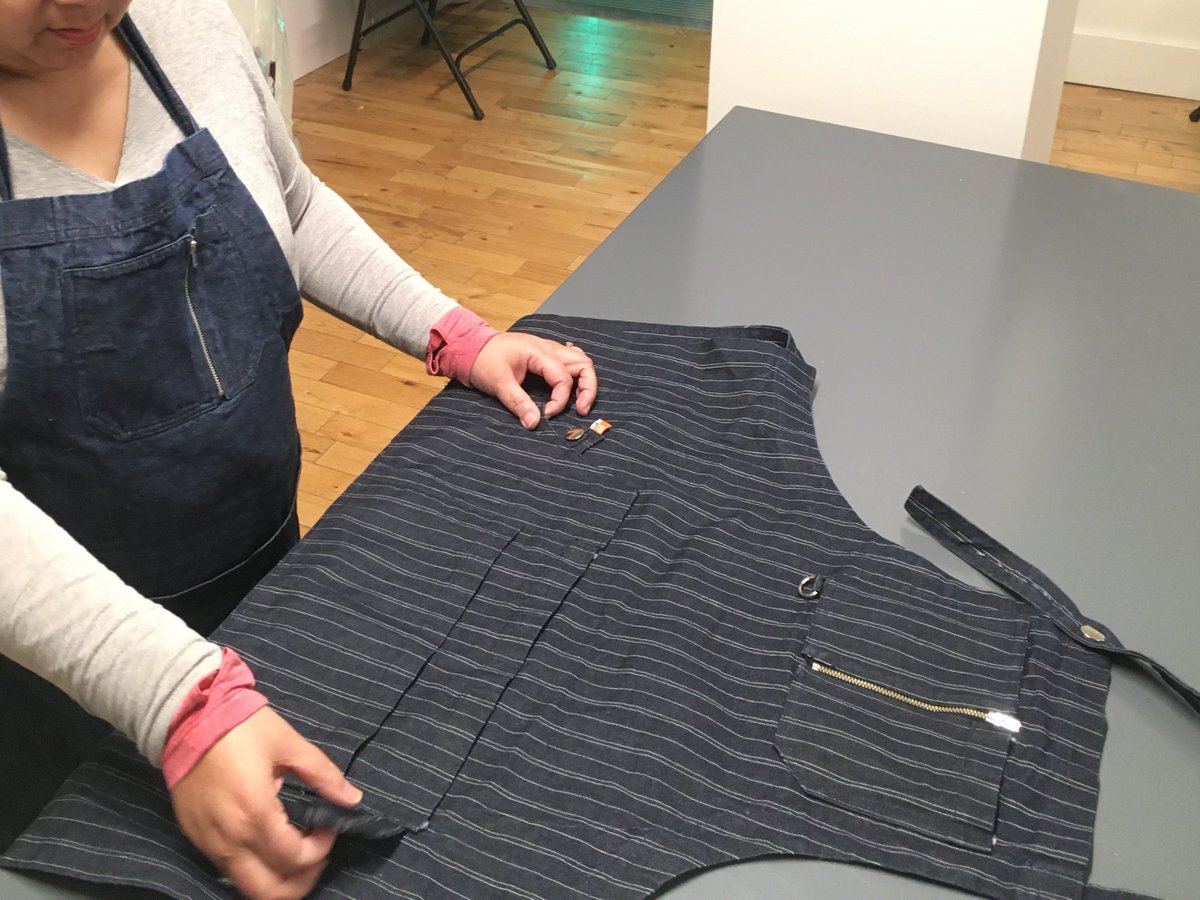 dgdesignlabs's tweet photo. "Is it a pinafore or an apron? There's lots of different sized #pockets and they're different depths. I really like the adjustable straps and the fact that it can fit a short, short body." feedback on the initial #apron concepts being shown @Gladstone_To #Art Studio #makers https://t.co/LA8pmRA3r7