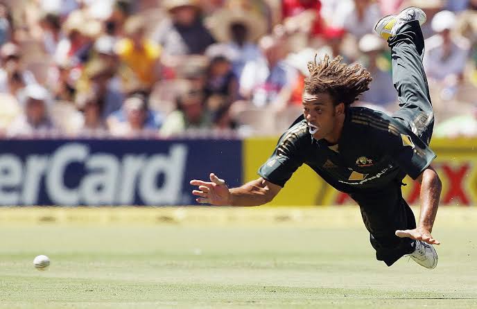 sagarcasm's tweet photo. Incredible team man. Could bat anywhere, could bowl medium pace as well as spin, caught almost everything and if he threw the ball, it would always hit the stumps. RIP #AndrewSymonds https://t.co/j7sNMMymn4