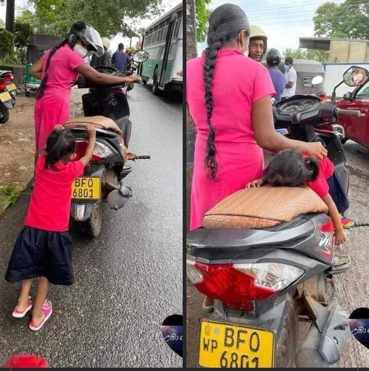 Mother and a daughter in a petrol queue. The little one has fallen asleep from exhaustion after a while. #GoHomeRajapakshas #GoHomeGota  look at the suffering you hv induced