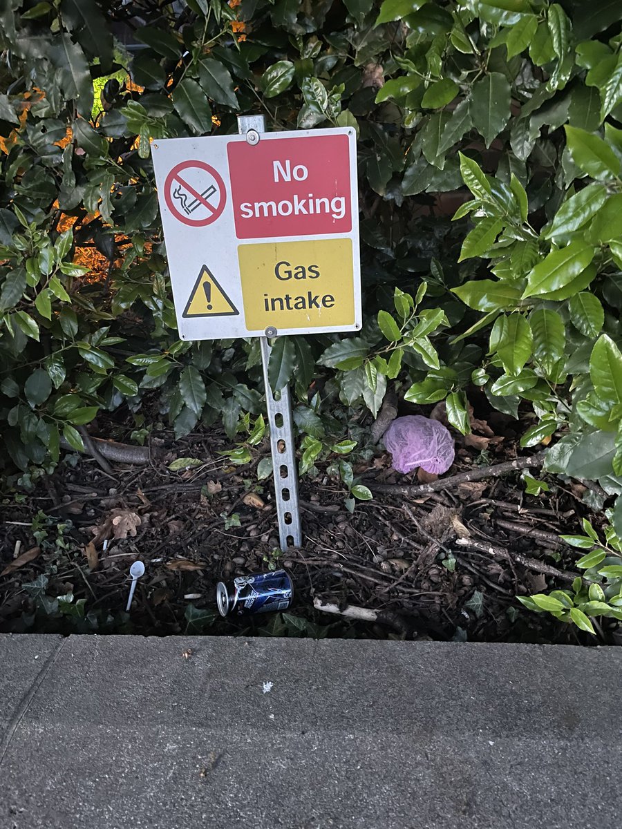 Tazzieoop's tweet photo. @Thumbelina1812 @LindaFoods Despite having a response to the concerns raised, it is still disgusting. PPE, cans and cigarette butts right in front of the “no smoking” sign. And still no sign of a bin at all!  It’s becoming a joke at this point guys… a basic bin would set you back a tenner… 

Do better. https://t.co/99I9u8915V