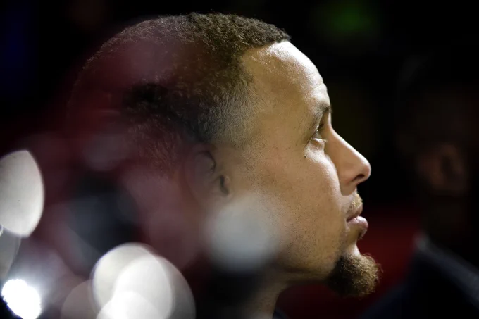 A profile headshot of Stephen Curry