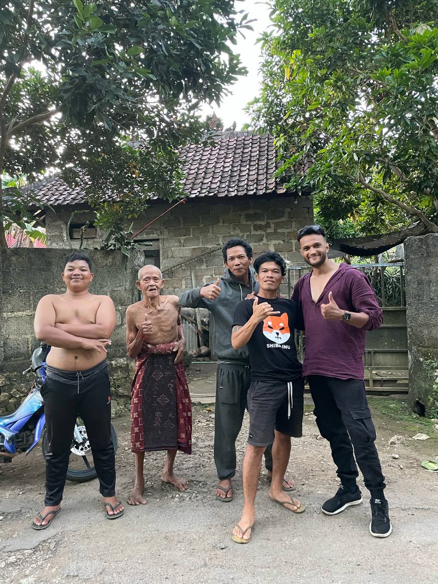 cryptoady's tweet photo. So I was travelling around on a scooter in Nusa Penida. Which is a small island in Indonesia. 

Saw this guy on the road wearing Shiba Inu T-shirt.

Had to get stop and interview him. https://t.co/0W6O8454IQ