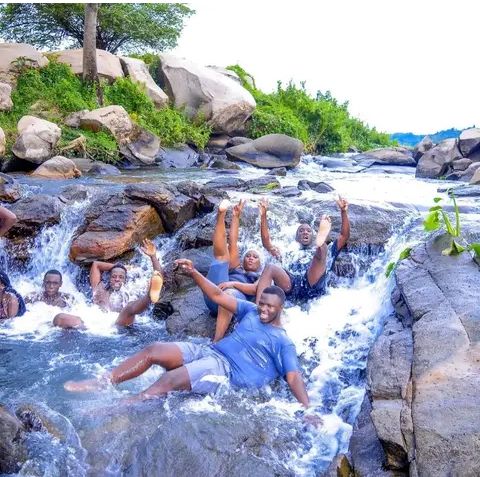 Water massage at busowoko falls beach in jinja Uganda.